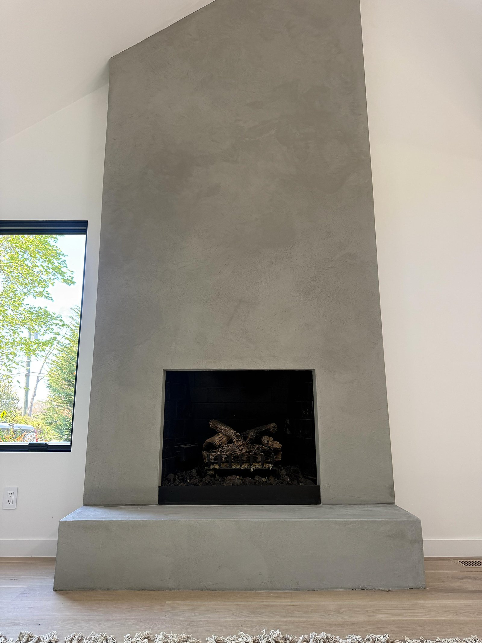Full-height microcement fireplace and chimney breast, Montauk residence — MarkOn® Walls