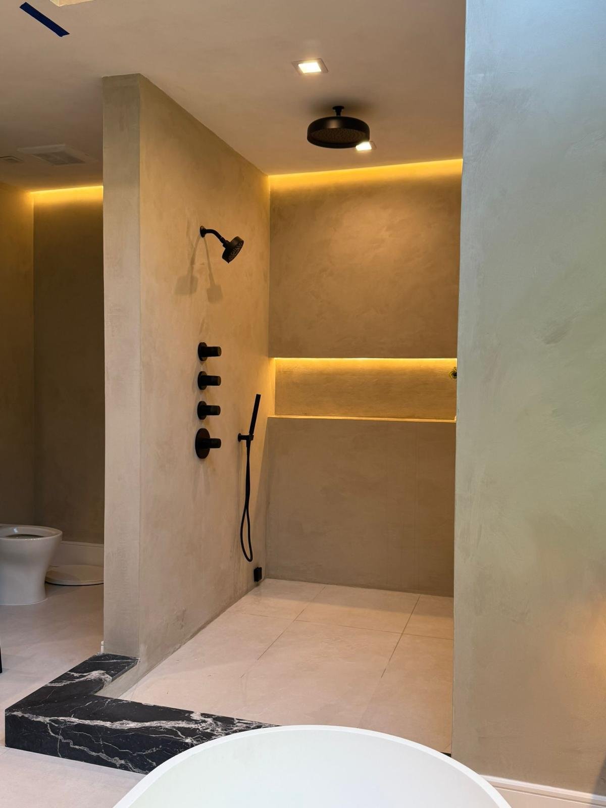№ 063 Williamsburg Spa — microcement wet room with black fixtures and LED cove, 2025 — MarkOn® Walls / Vlad Markov
